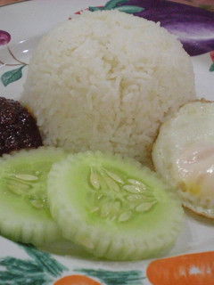 A picture of Nasi Lemak (Rice Cooked in Coconut Milk).