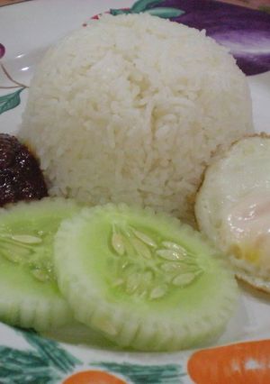 A picture of Nasi Lemak (Rice Cooked in Coconut Milk).