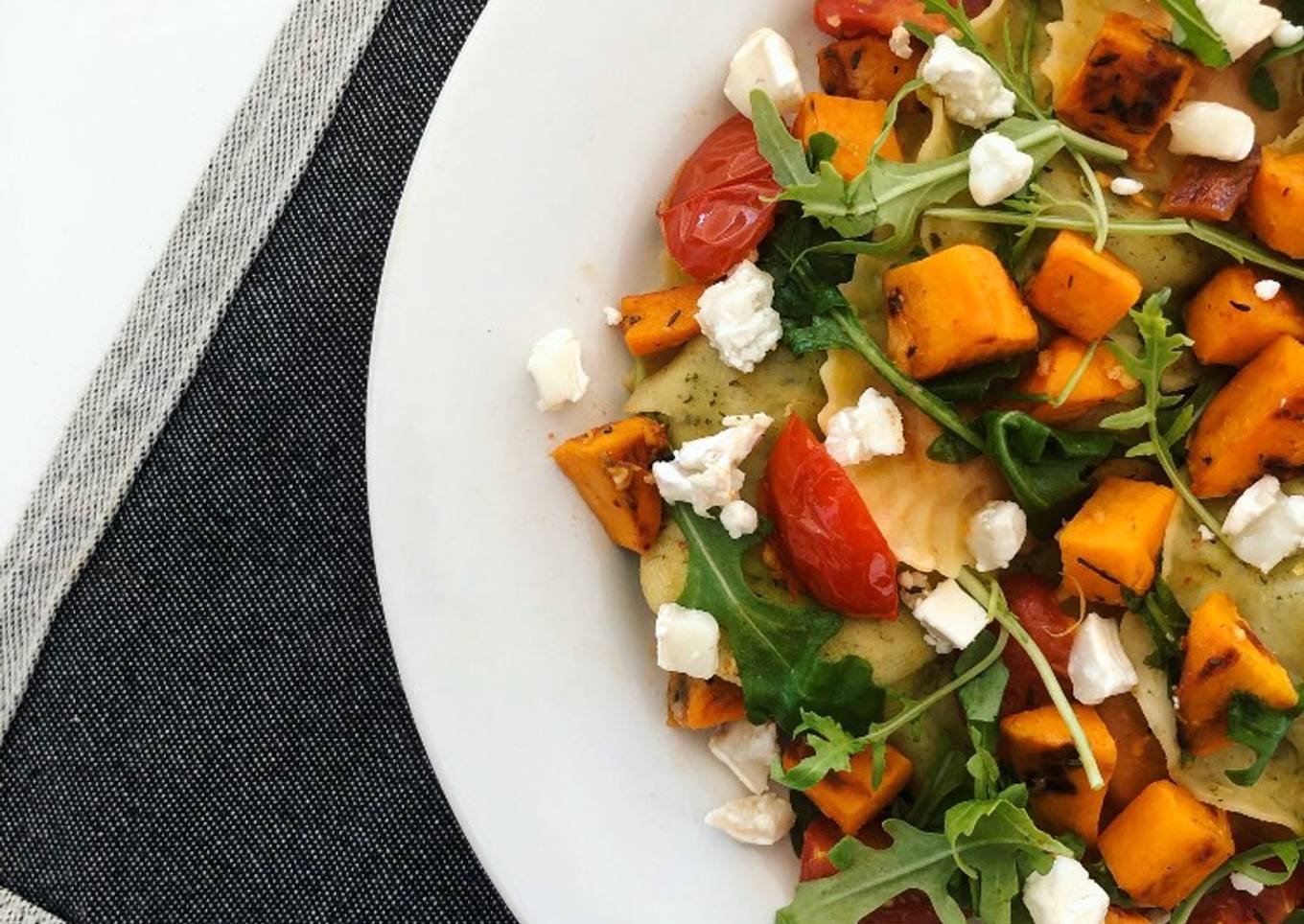Sweet Potato Ravioli with Cherry Tomatoes, Goat Cheese and Arugula