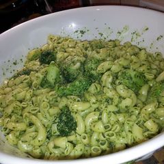 A picture of Pesto pasta with broccoli.