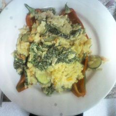 A picture of Vegetable risotto stuffed peppers.