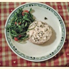A picture of Filet mignon with green peppercorn sauce.