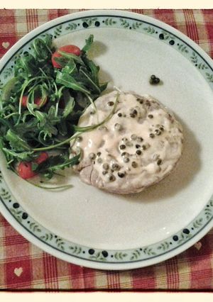 A picture of Filet mignon with green peppercorn sauce.