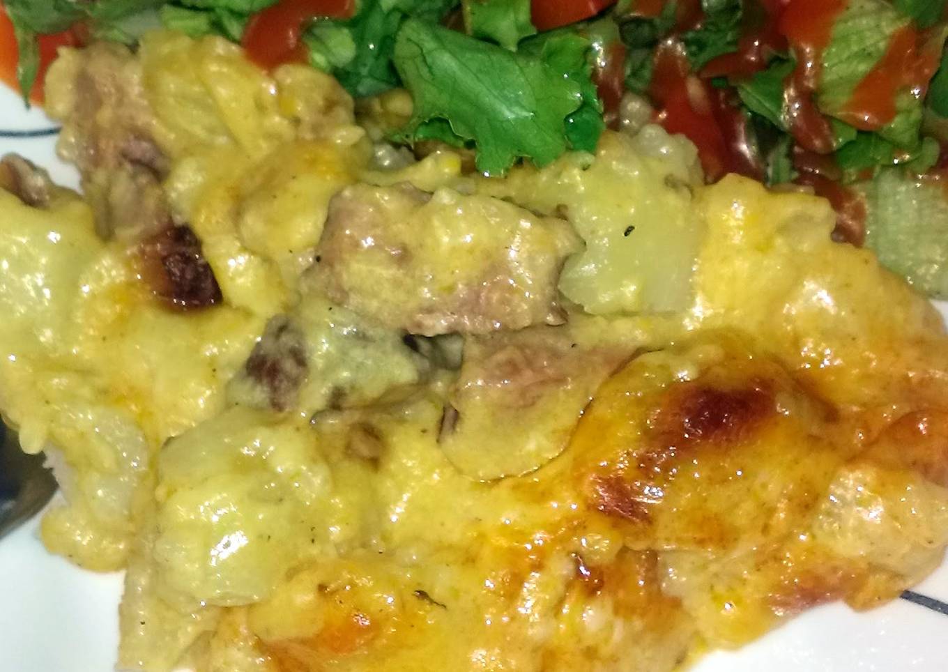 Cheese with potatoes and smoked sausage
