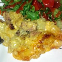 A picture of Cheesy potatoes with smoked sausage.