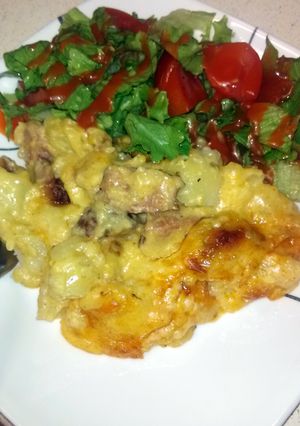 A picture of Cheesy potatoes with smoked sausage.
