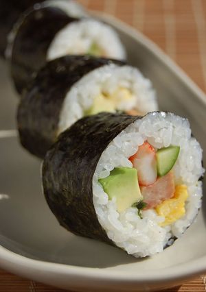 A picture of Sushi Rolls with Avocado & Spam.