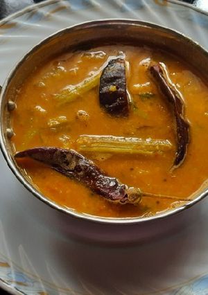 A picture of Drum 🥁 stick mix veggies spicy sambar.