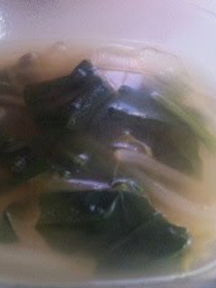 A picture of Alpine Leek Consommé Butter Soup.