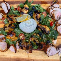 A picture of Grilled peaches, pork and burrata.