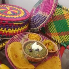 A picture of Sarso ka Saag or Makkai ki roti.