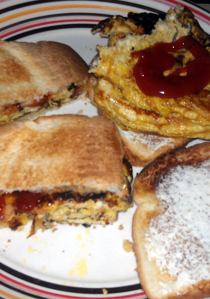 A picture of omlet on toast.