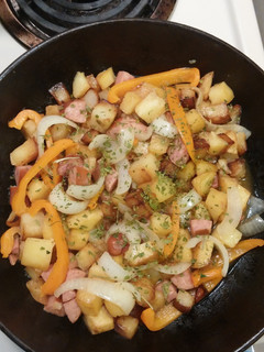 A picture of Smothered Potatoes with Bell Pepper Onions Polish Sausage.