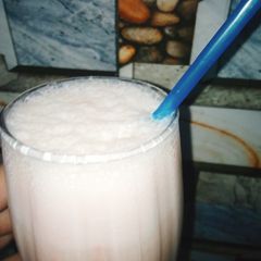 A picture of Iced banana shake with rooh afza 😋😋😍😍.