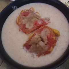 A picture of Tomato kofta in white gravy.