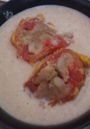 A picture of Tomato kofta in white gravy.