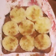 A picture of Sprouted Grain Toast Almond Butter Banana and Cinnamon.
