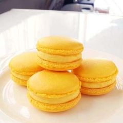 A picture of Lemon Macarons with Italian Meringue.