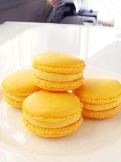 A picture of Lemon Macarons with Italian Meringue.