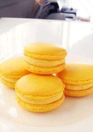 A picture of Lemon Macarons with Italian Meringue.
