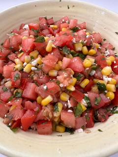 A picture of Tomato Salad with Corn, Feta, and Mint.