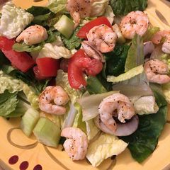 A picture of Ninja Foodie Grill Lemon Pepper Shrimp for a Salad.