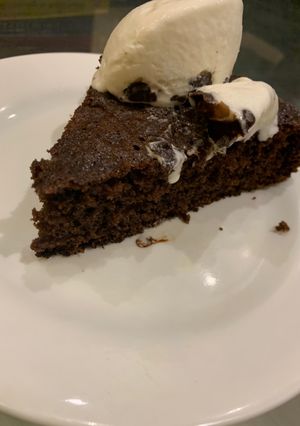 A picture of Chocolate cake with homemade ice cream.