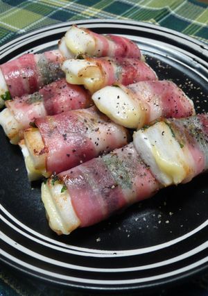 A picture of Hanpen Fish Cake and Cheese Wrapped with Shiso Leaves and Bacon.