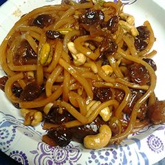 A picture of Fruit nuts and Udon noodle breakfast.