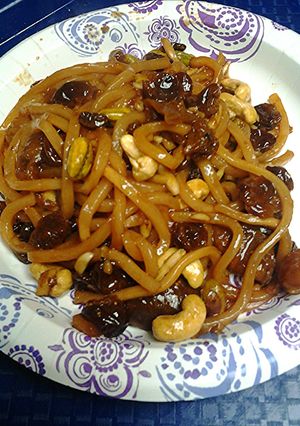 A picture of Fruit nuts and Udon noodle breakfast.
