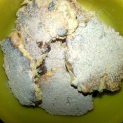 A picture of oat biscuit with cinnamon icing sugar.
