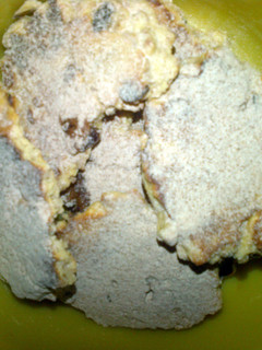 A picture of oat biscuit with cinnamon icing sugar.