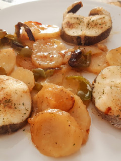 Una foto de Rodajas de merluza al horno