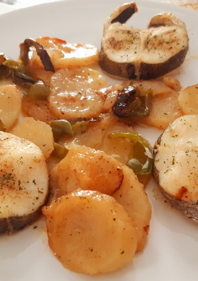 Una foto de Rodajas de merluza al horno