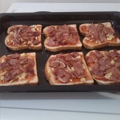 A picture of Bacon bread pizza.