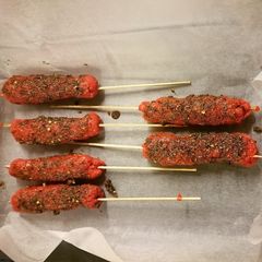 A picture of Minced beef skewer with assorted spices.
