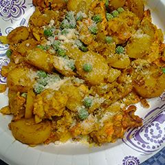 A picture of Eggs potatoes and peas.