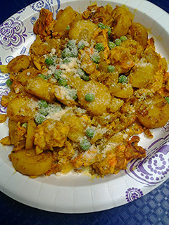 A picture of Eggs potatoes and peas.