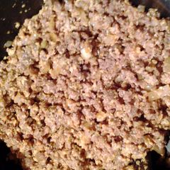 A picture of ravioli filling and sauce.