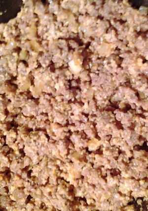 A picture of ravioli filling and sauce.