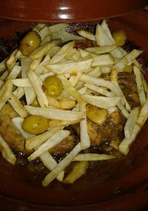 A picture of Chicken Tagine with Olives and Fried Potatoes.