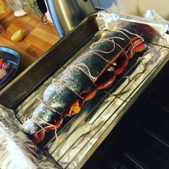A picture of Whole roasted stuffed salmon.