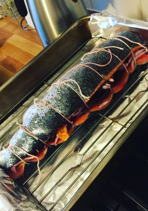 A picture of Whole roasted stuffed salmon.