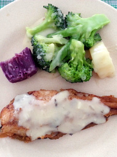 A picture of Pan seared fish fillet with vegetable and mushroom gravy.