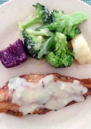 A picture of Pan seared fish fillet with vegetable and mushroom gravy.