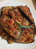 Melanzane al forno, con pomodorini, aglio, capperi, aromi e olio evo