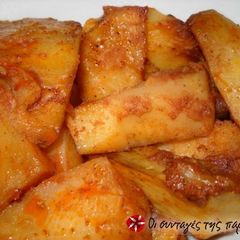 A picture of Spicy potatoes in the oven.