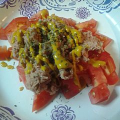 A picture of Tuna and Tomatoes.