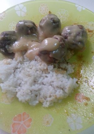 A picture of chicken meatballs in chicken cream soup sauce.