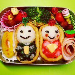 A picture of Doll's Day Bento with Inari Sushi Hina Dolls.